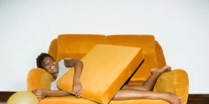 Young woman lying on sofa