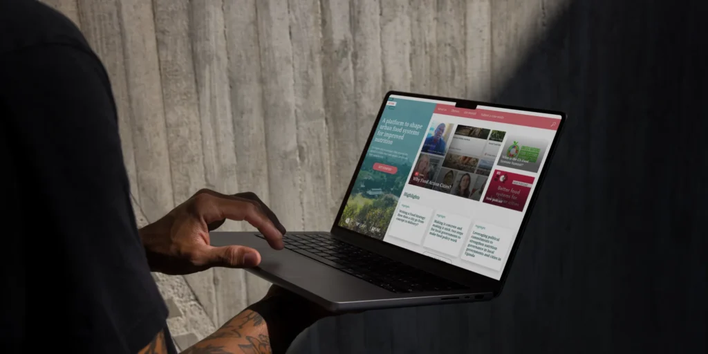Laptop mockup showing Food-Action-Cities website