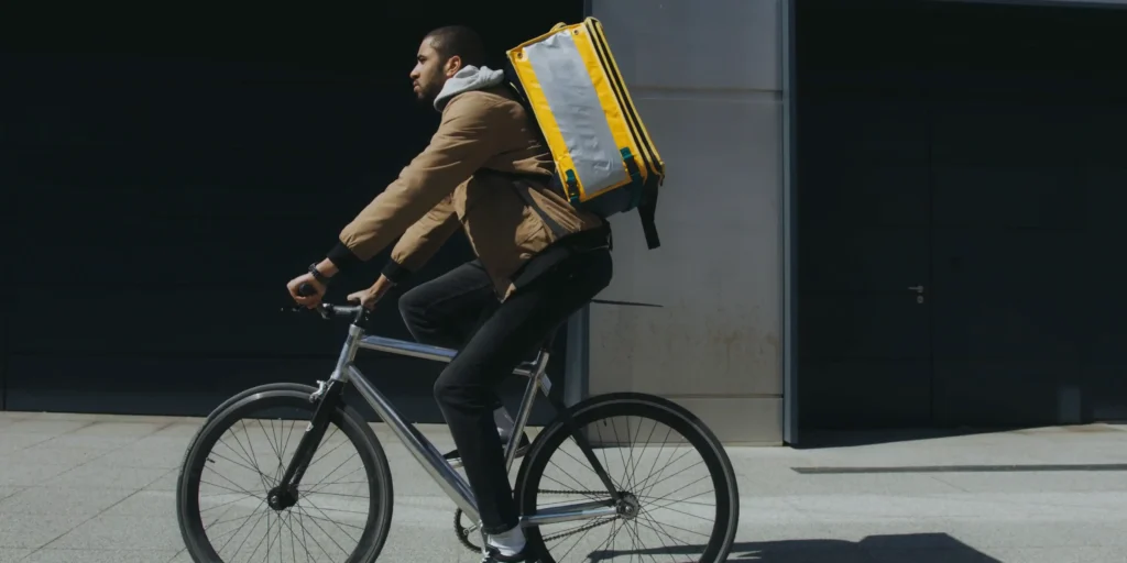 man biking with the delivery bag