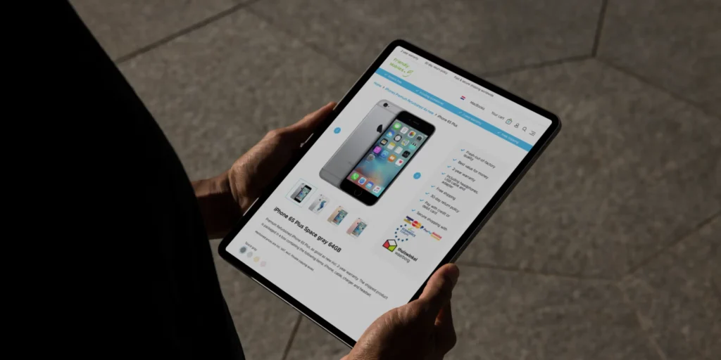 Tablet mockup showing the Tech2Com website