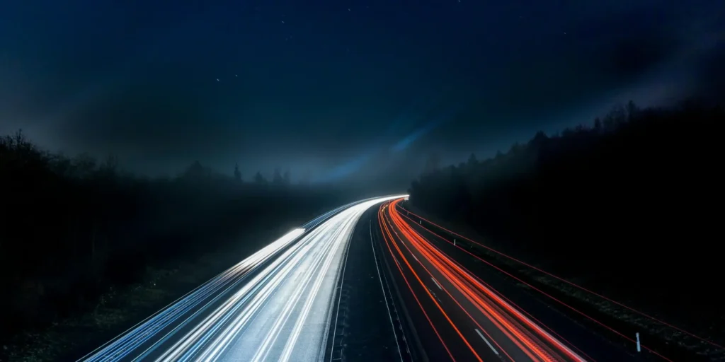 highway at night with headlights