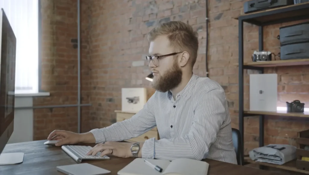Man is working on a laptop