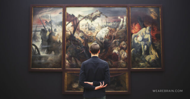 Picture of a man looking at a painting