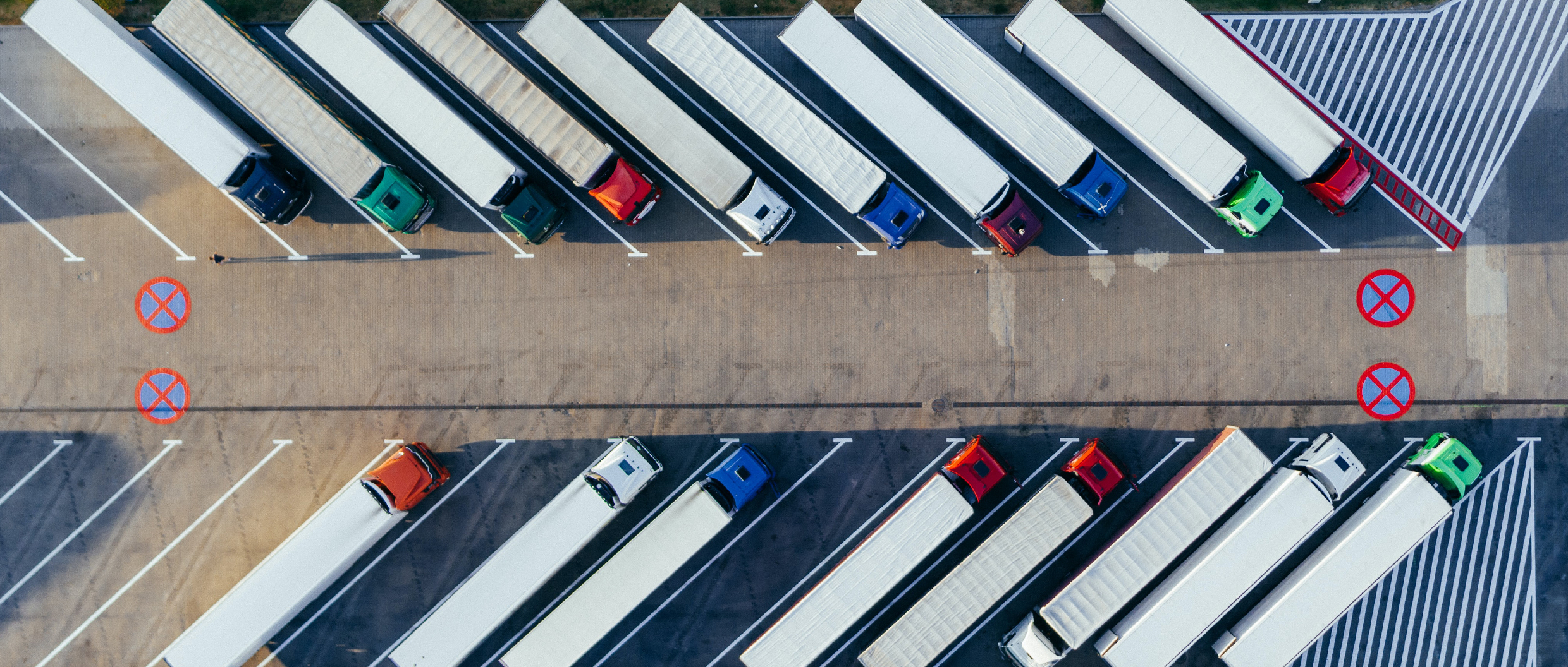 Aerial photo of multiple trucks parked in parallel