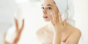 Woman applying face cream