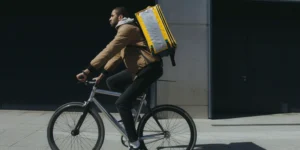 man on a bike with the delivery bag
