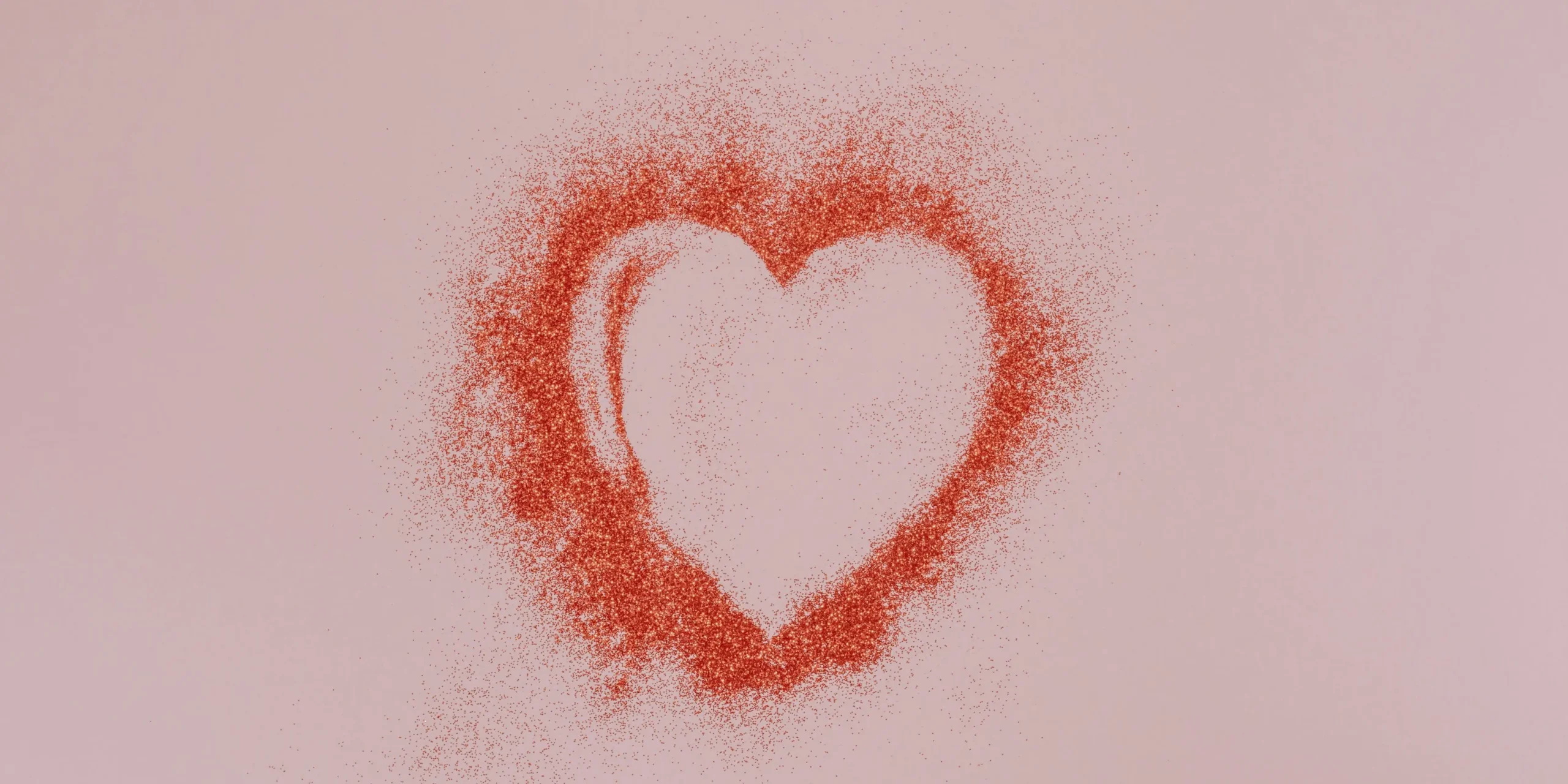 Image of a heart stencilled on a pink wall