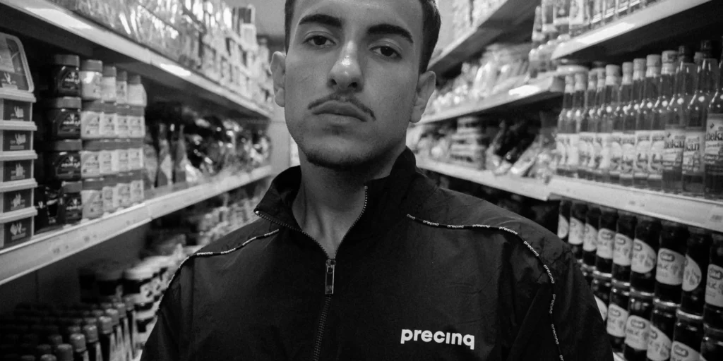 young man wearing Precinq tracksuit