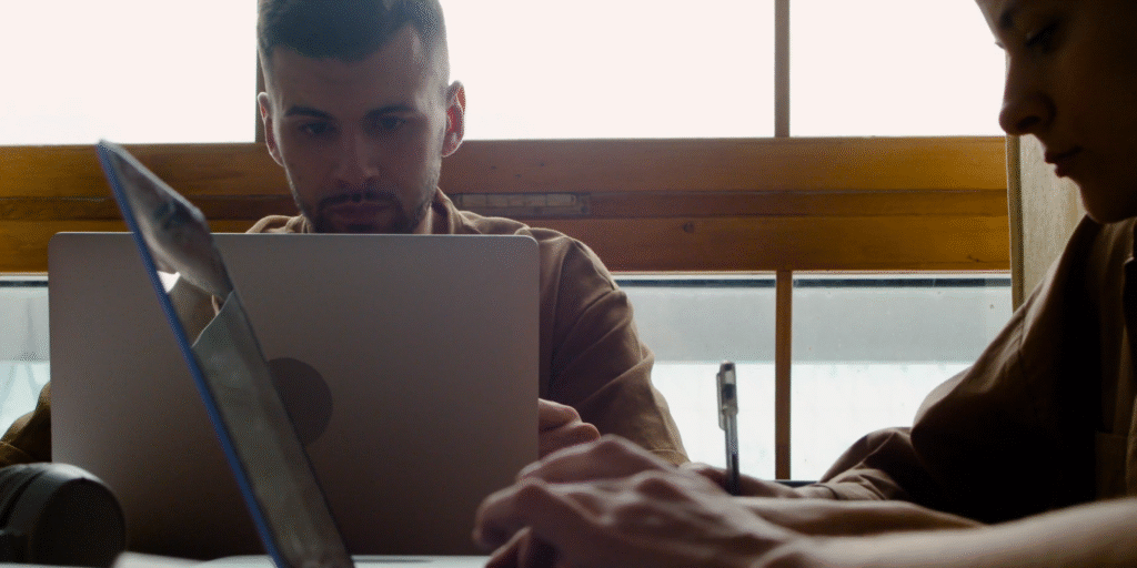 Two people studying using their laptops