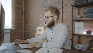 Man is working on a laptop